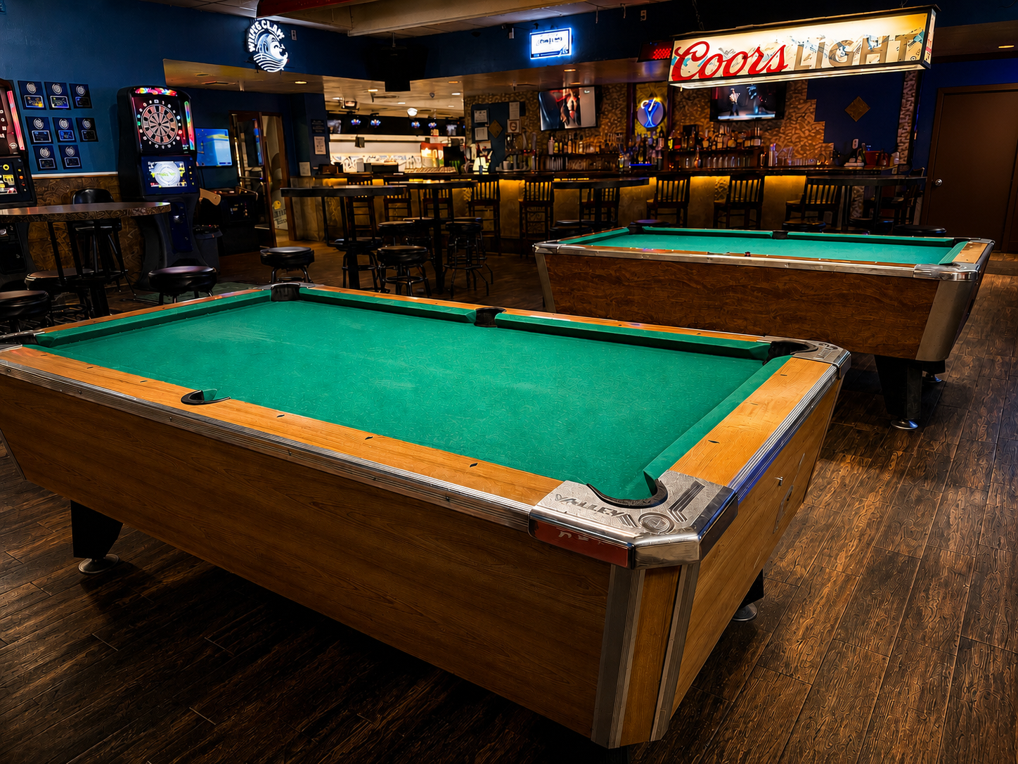 Bar and lounge area with pool tables at Mesa East Bowl